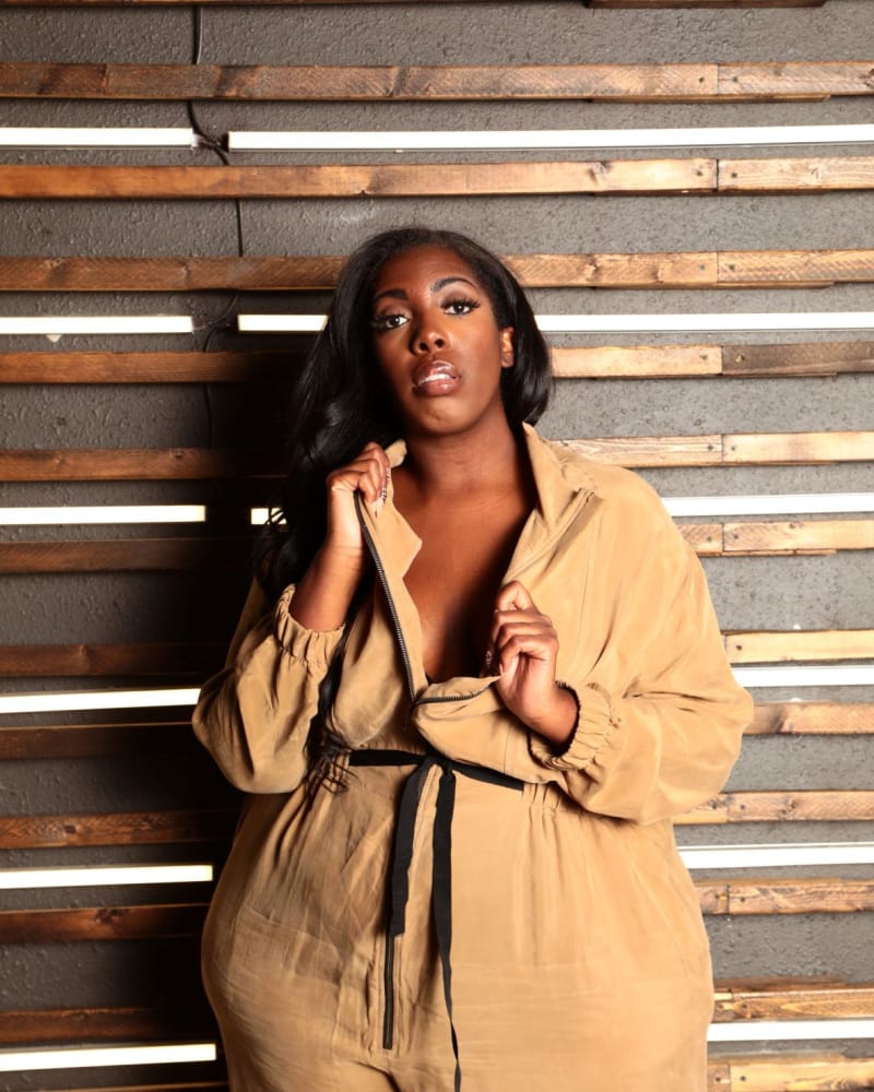 Front of a model wearing a size 2X The Flightsuit Cupro Jumpsuit in Olive by Sante Grace. | dia_product_style_image_id:237561